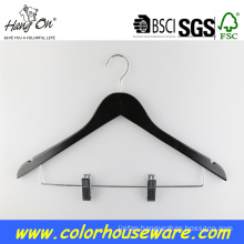 Black wooden hanger with clips